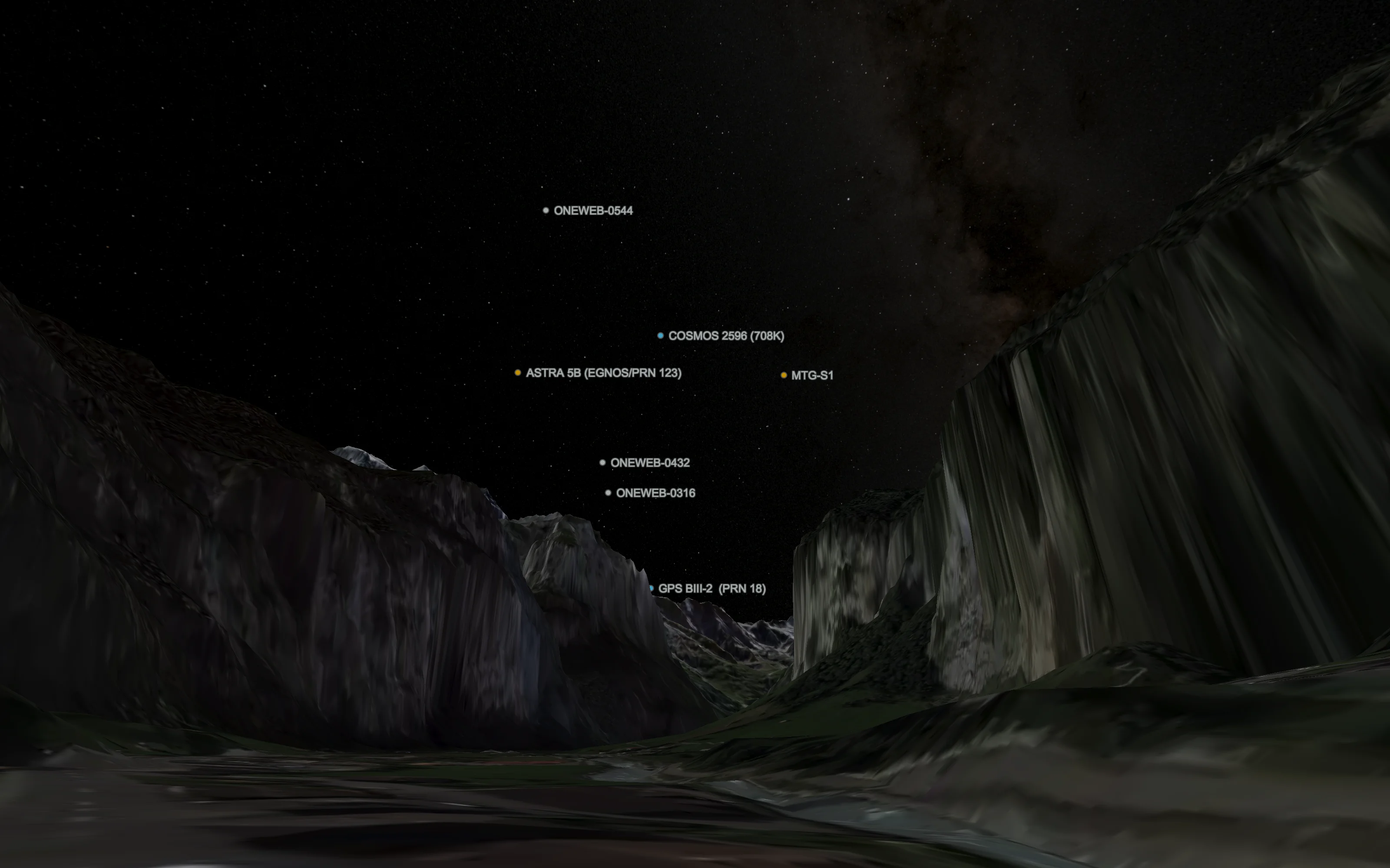 Night sky over the Lauterbrunnen valley, with labelled navigation, weather and OneWeb satellites above the cliffs